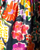 Close-up of a colorful floral fabric with vibrant patterns.