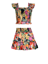 Colorful floral top and skirt set on a white background