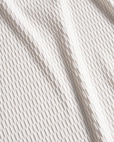 Close-up of beige fabric with subtle texture