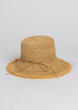 Beige straw hat with a bow on a light gray background