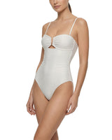 White ribbed swimsuit worn by a model on a white background