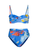 Colorful bikini set with fish pattern on a white background