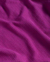 Close-up of textured purple fabric