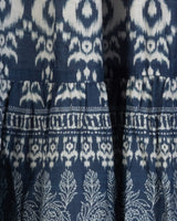 Close-up of a blue fabric with white ikat pattern