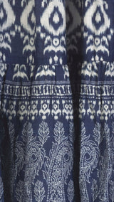 Close-up of a blue fabric with white ikat pattern