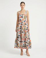 Woman wearing a floral dress on a white background