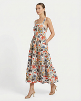 Woman wearing a floral dress on a white background