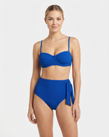 Woman wearing a blue bikini set on a white background