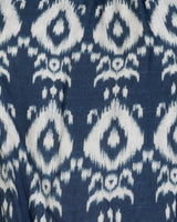 Close-up of a blue fabric with white ikat pattern