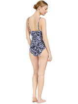 the back of a model wearing french cup black and white leopard print one piece swimsuit with a deep plunge-neckline, adjustable back straps, and shirring at the front waist with power compression mesh lining at the front lower torso