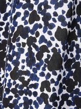 Close up and detailed shot of black white and blue leopard print 100% organic certified cotton