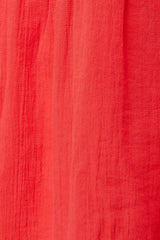 Close up and detailed shot of coral red 100% organic certified cotton