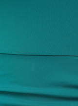 Close up and detailed short of green 78% Recycled Repreve® Nylon 22% Spandex fabric