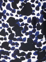 Close up and detailed shot of Black and white leopard print 78% Recycled Repreve® Nylon 22% Spandex fabric