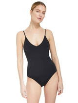 Model wearing black v-neckline one piece bathing suit with adjustable back straps
