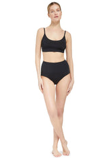 model wearing a black scoop neckline bikini top with under-bust band and adjustable straps with matching high rise bikini bottom