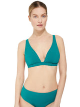 Model wearing a green plunge neckline, classic bikini top with adjustable straps and an elastic underband with a matching classic midrise bikini bottom