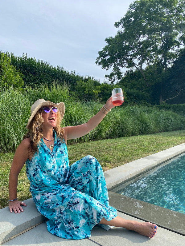 woman at pool with glass of rose