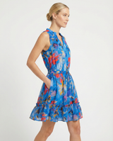 Woman wearing a colorful dress on a white background