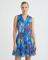 Woman wearing a colorful floral dress on a white background