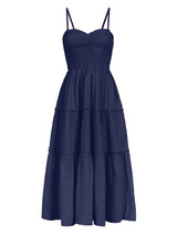 Navy blue tiered dress on a white background