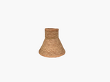 Woven natural fiber lampshade on a white background