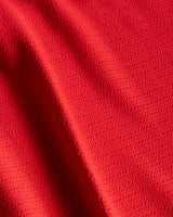 Close-up of red fabric with folds