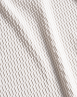 Close-up of white fabric with subtle texture