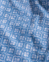Close-up of blue fabric with a subtle pattern