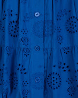 Blue shirt with intricate cut-out patterns and buttons