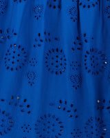 Blue fabric with intricate cut-out patterns