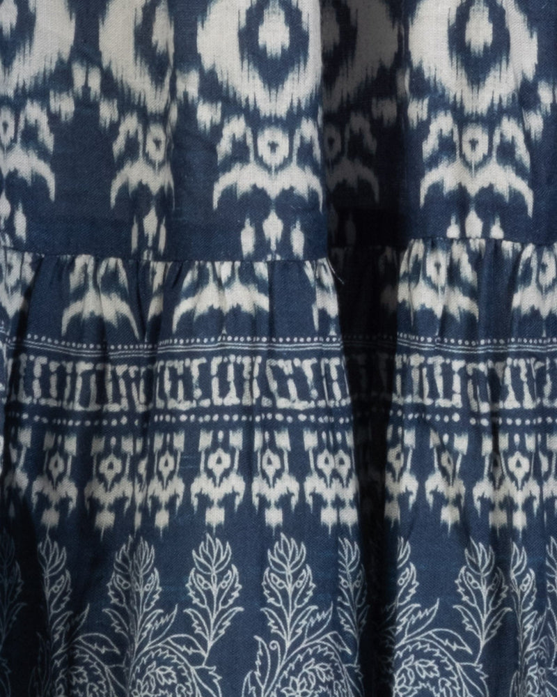 Close-up of a blue fabric with white ikat pattern