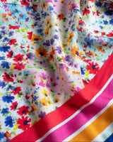 Colorful floral fabric with a red and white stripe