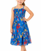 Young girl wearing a blue floral dress on a white background
