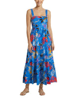 Woman wearing a blue floral dress on a white background