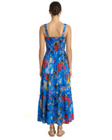 Woman wearing a colorful dress with a white background