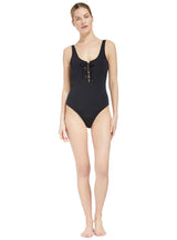 model wearing a black tank silhouette one piece swimsuit with lace-up front 
