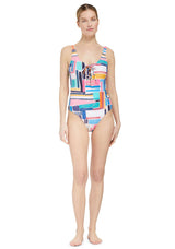 model wearing a geometric and graphic colored classic tank silhouette one piece swimsuit with lace-up front 