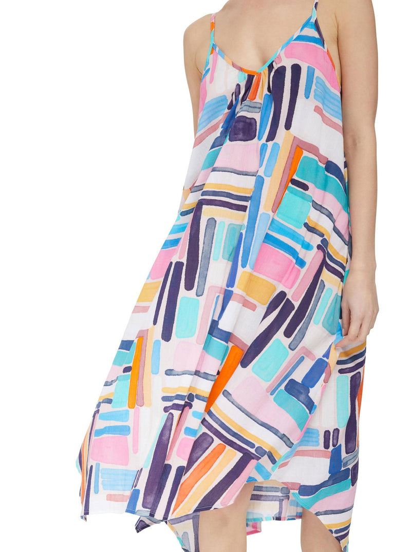 Close up and detailed shot of geometric and graphic colored strappy and long flowy dress with adjustable back shoulder straps, v-neckline front and pockets 
