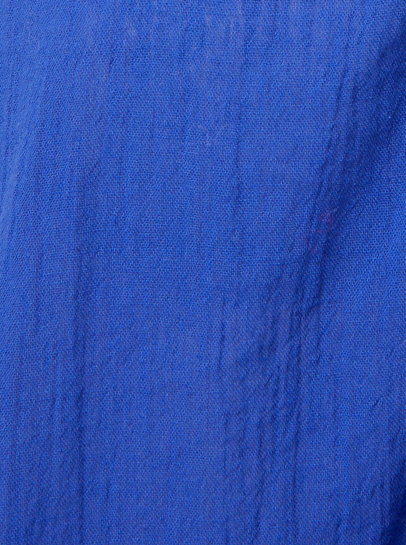Close up and detailed shot of cobalt blue 100% organic certified cotton 