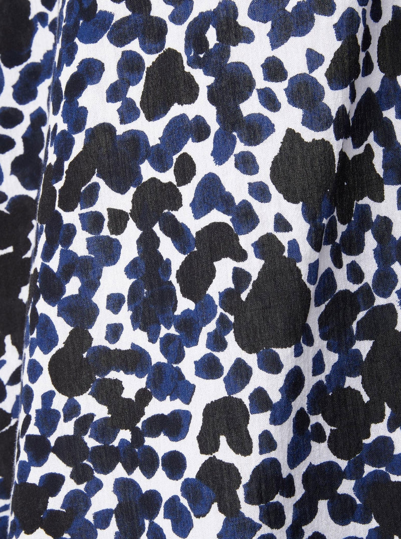 Close up and detailed shot of black white and blue leopard print 100% organic certified cotton 