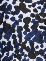 Close up and detailed shot of black and white leopard print 100% organic certified cotton 