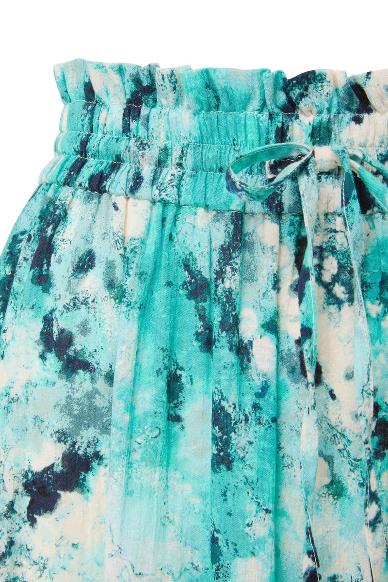 Close up and detailed shot of ocean print inspired midi length skirt with elastic waistband with drawstring detail 