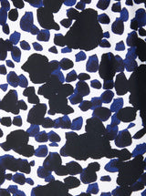Close up and detailed shot of a black and white leopard print 78% Recycled Repreve® Nylon 22% Spandex fabric