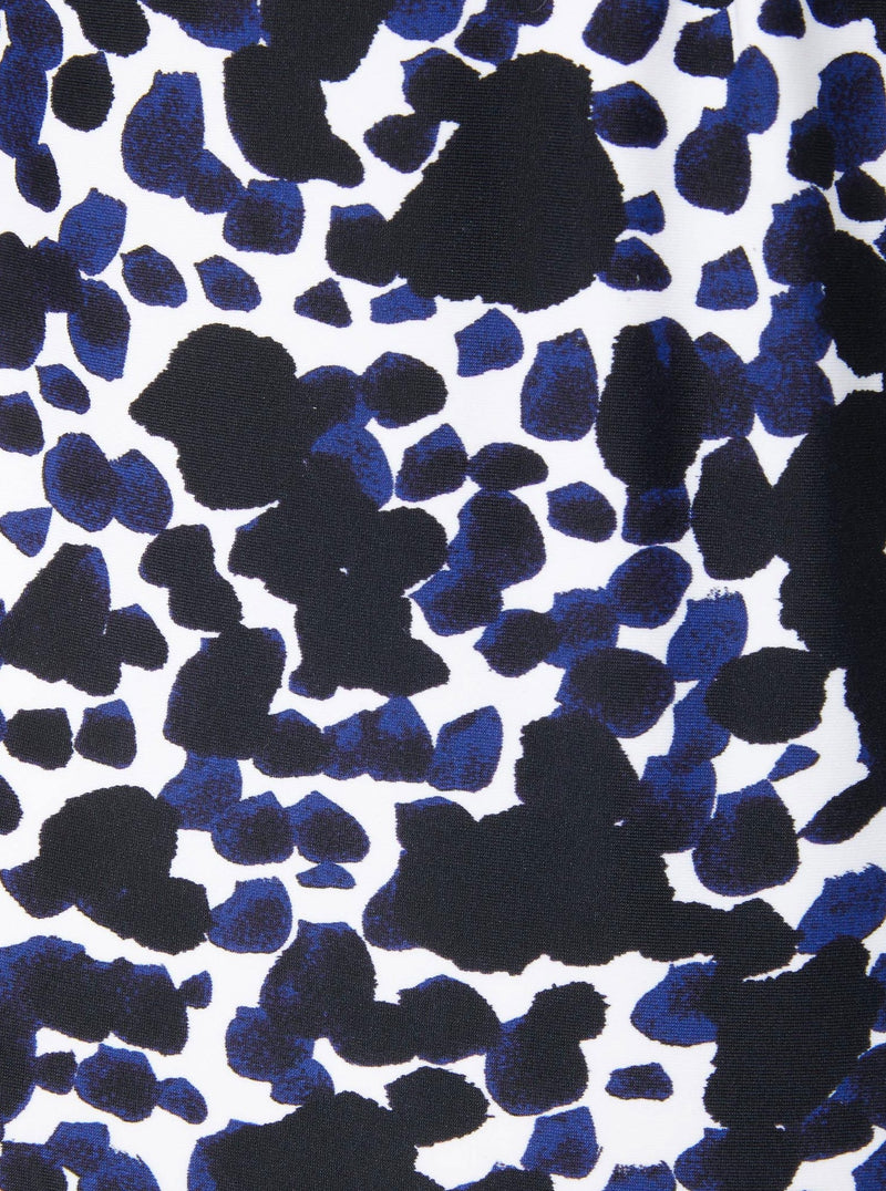 Close up and detailed shot of a black and white leopard print 78% Recycled Repreve® Nylon 22% Spandex fabric