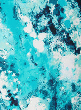 Close up and detailed shot of an ocean print 78% Recycled Repreve® Nylon 22% Spandex fabric