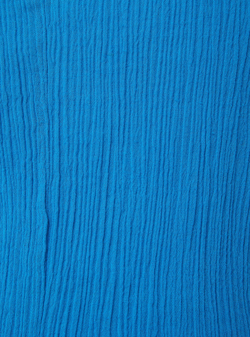 Close up shot of grotto blue (light blue) 100% certified organic cotton 