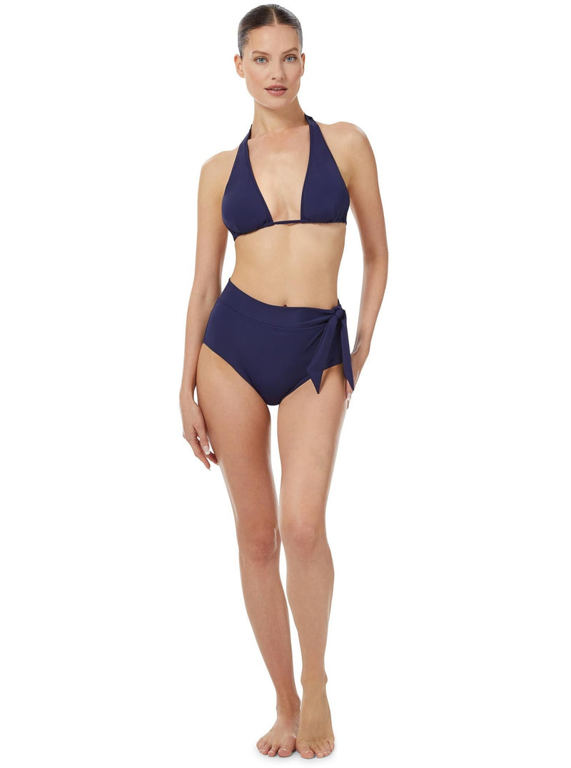 Model wearing a navy triangle bikini top with halter neck tie, adjustable cups, and a spaghetti tie under the bust with matching high waist bottoms with a side knot 