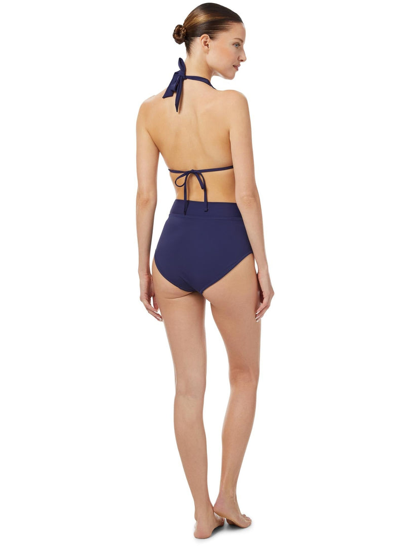 The back of a model wearing a navy triangle bikini top with halter neck tie, adjustable cups, and a spaghetti tie under the bust with matching high waist bottoms with a side knot 