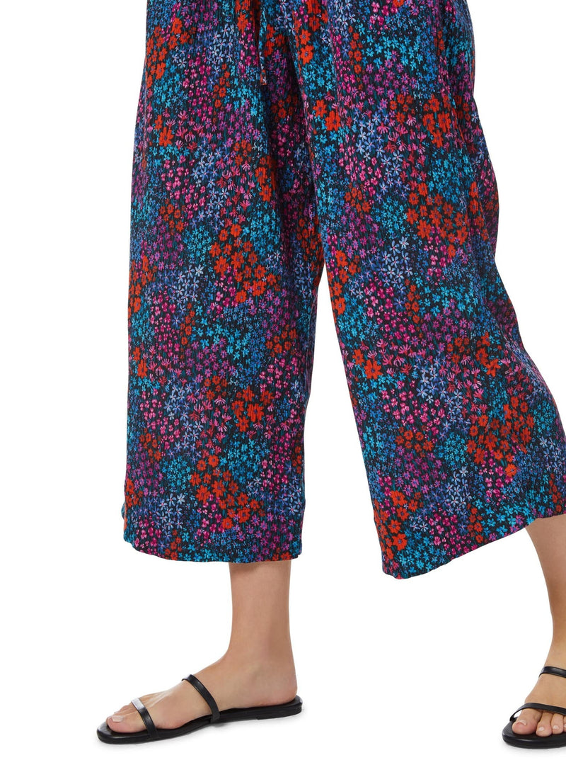  Close up shot of a floral pattern organic cotton beach pants with wide leg silhouette 